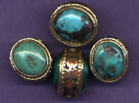 Nilofur Turquoise with brass and coral surround